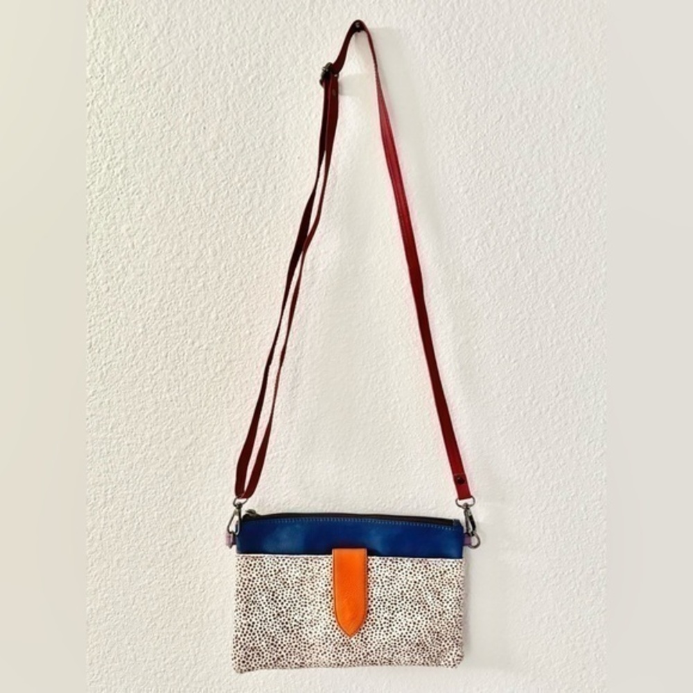 Soruka red purple orange and blue crossbody wristlet purse with pony hair detail